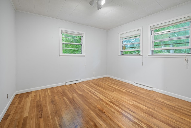 5 Dogford Rd, Hanover, NH 03750 - spare room with baseboard heating, crown molding, a baseboard radiator, light wood-style floors, and baseboards