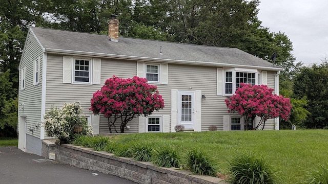 19 Bradford Dr, Salem, NH 03079 - bi-level home with a chimney, a front yard, and roof with shingles