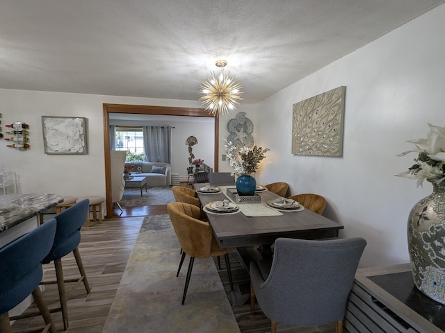 19 Bradford Dr, Salem, NH 03079 - dining space with wood finished floors and a chandelier