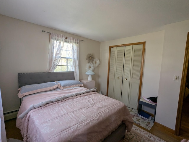19 Bradford Dr, Salem, NH 03079 - bedroom with baseboard heating, a closet, and wood finished floors