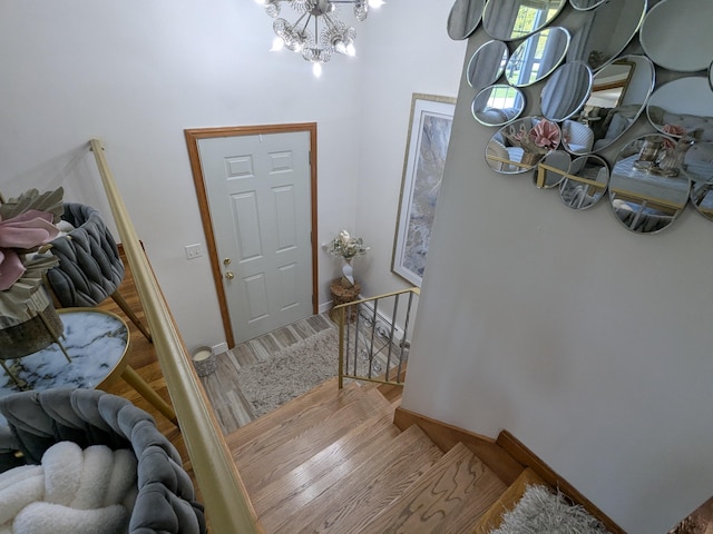 19 Bradford Dr, Salem, NH 03079 - entrance foyer featuring wood finished floors, a chandelier, and baseboards