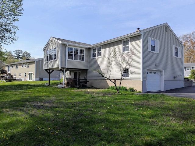 19 Bradford Dr, Salem, NH 03079 - rear view of property with an attached garage, a lawn, and a chimney