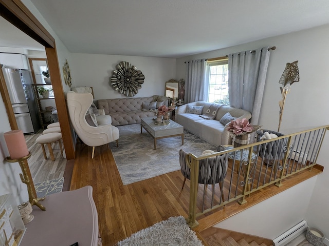 19 Bradford Dr, Salem, NH 03079 - living area with baseboard heating and wood finished floors
