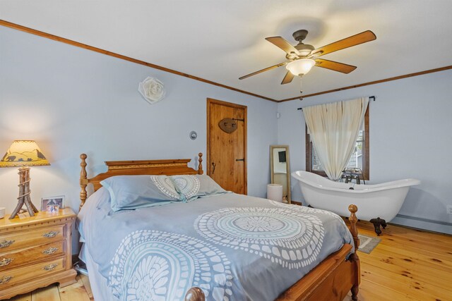 126 Stoddard Rd, Columbia, NH 03576 - bedroom featuring ornamental molding, baseboard heating, light wood-style flooring, and a ceiling fan