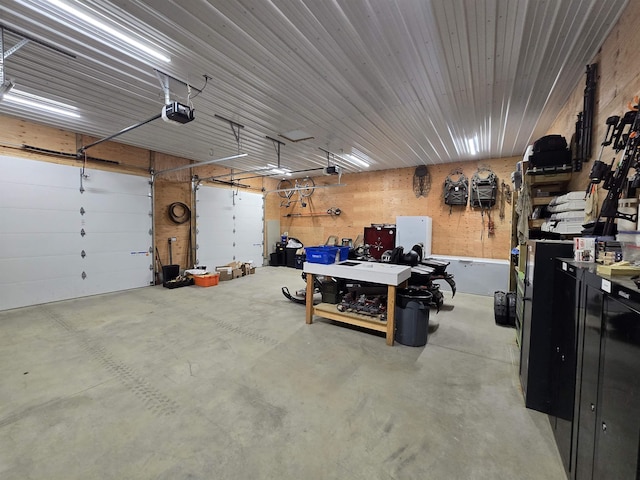 126 Stoddard Rd, Columbia, NH 03576 - garage with a garage door opener and a workshop area