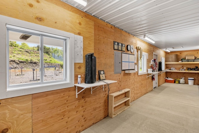 126 Stoddard Rd, Columbia, NH 03576 - kitchen featuring wooden walls, electric panel, and carpet