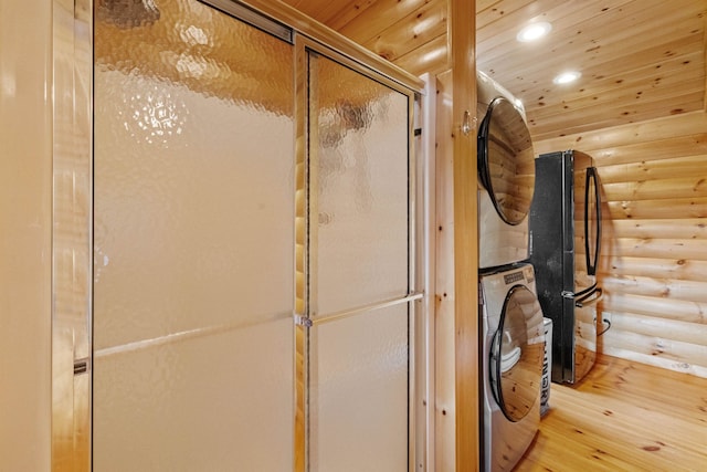 126 Stoddard Rd, Columbia, NH 03576 - full bath featuring stacked washer / dryer, rustic walls, wooden ceiling, wood finished floors, and recessed lighting