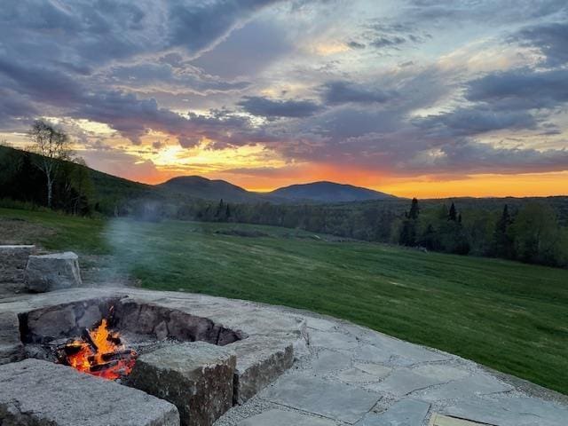 126 Stoddard Rd, Columbia, NH 03576 - view of patio with a fire pit and a mountain view