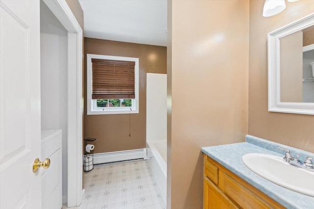 53 Crestview Dr, Jaffrey, NH 03452 - full bathroom with a baseboard heating unit, tile patterned floors, vanity, a bath, and washer / dryer