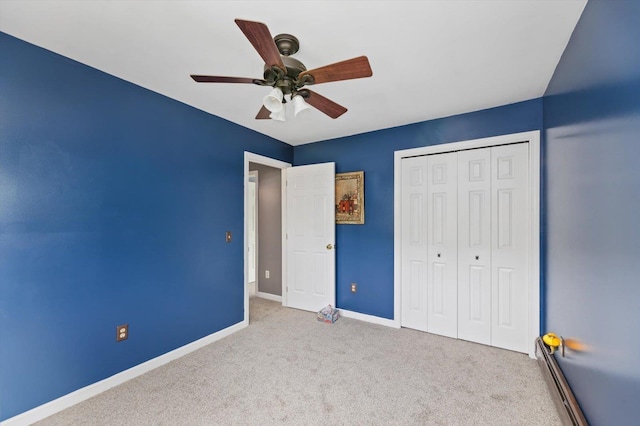 53 Crestview Dr, Jaffrey, NH 03452 - unfurnished bedroom with carpet, baseboards, a closet, baseboard heating, and a ceiling fan