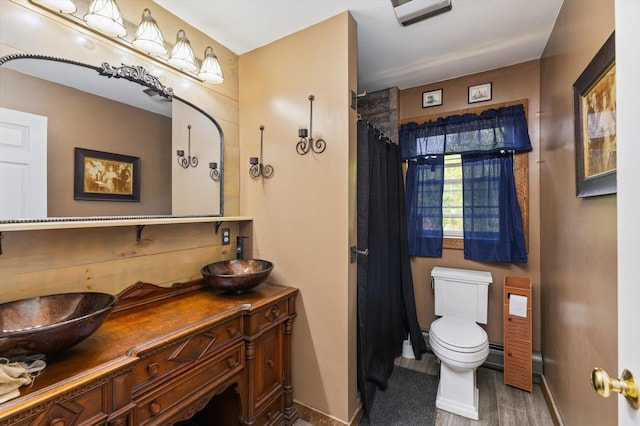 53 Crestview Dr, Jaffrey, NH 03452 - bathroom featuring double vanity, wood finished floors, baseboards, toilet, and a shower with shower curtain
