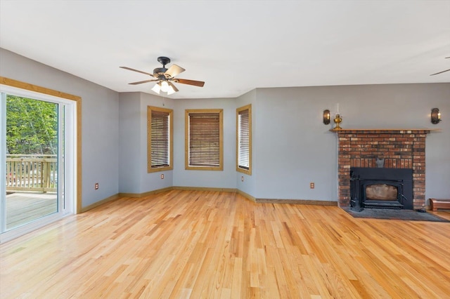 53 Crestview Dr, Jaffrey, NH 03452 - unfurnished living room with ceiling fan, wood finished floors, baseboards, and a fireplace