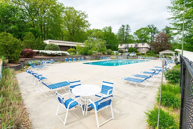 17 Silvestri Cir Unit 4, Derry, NH 03038 - community pool with a patio, a gazebo, and view of wooded area