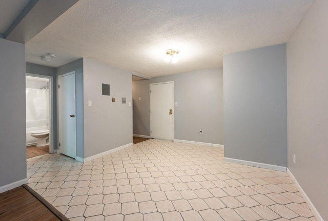 17 Silvestri Cir Unit 4, Derry, NH 03038 - empty room featuring baseboards and a textured ceiling