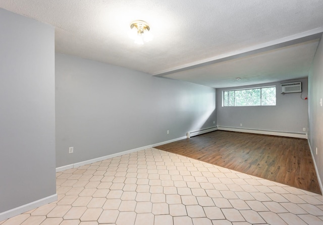 17 Silvestri Cir Unit 4, Derry, NH 03038 - empty room featuring a wall mounted AC, wood finished floors, beamed ceiling, a baseboard radiator, and baseboards