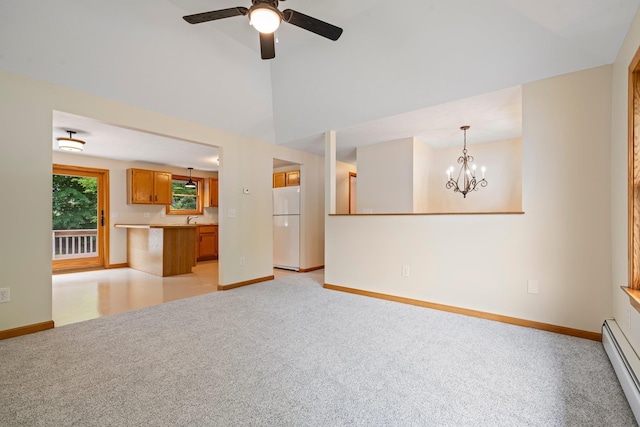 40 Trolley St, Manchester, NH 03103 - unfurnished living room with baseboard heating, light colored carpet, baseboards, ceiling fan, and vaulted ceiling
