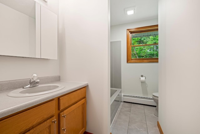 40 Trolley St, Manchester, NH 03103 - full bath featuring a baseboard radiator, vanity, toilet, and tile patterned flooring