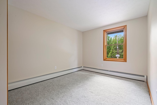 40 Trolley St, Manchester, NH 03103 - spare room with carpet flooring, a baseboard heating unit, and baseboards