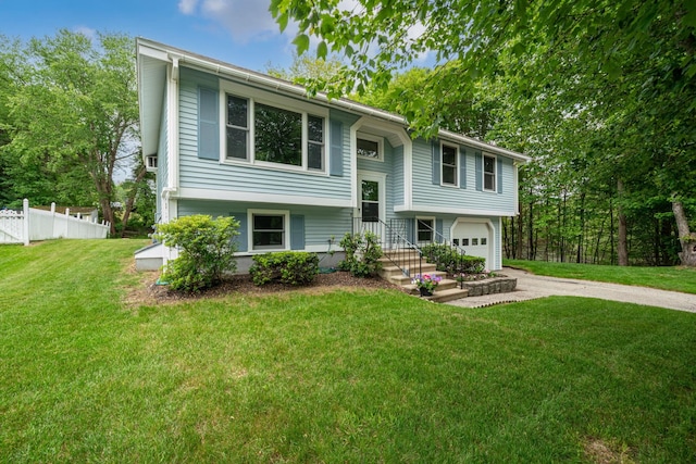 40 Trolley St, Manchester, NH 03103 - split foyer home featuring driveway and an attached garage