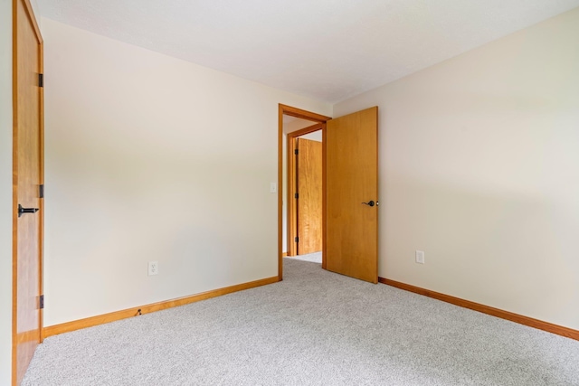 40 Trolley St, Manchester, NH 03103 - carpeted spare room with baseboards