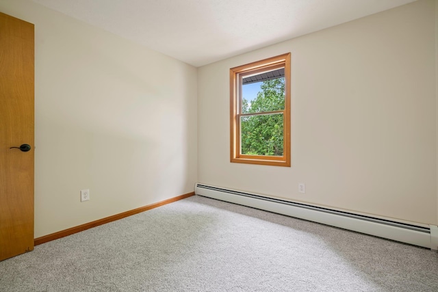 40 Trolley St, Manchester, NH 03103 - carpeted spare room with baseboard heating and baseboards