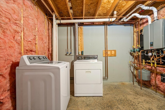 40 Trolley St, Manchester, NH 03103 - washroom with washing machine and dryer and tankless water heater