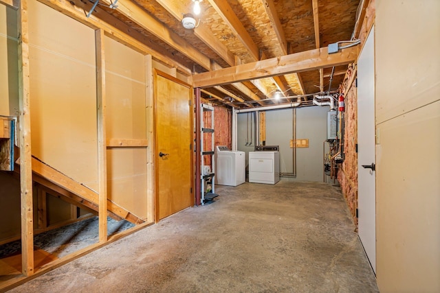 40 Trolley St, Manchester, NH 03103 - unfinished below grade area featuring washer and dryer and water heater