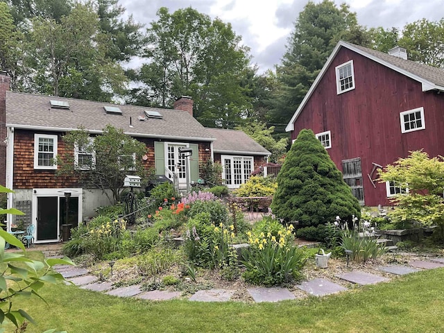 2 Mack Hill Rd, Amherst, NH 03031 - rear view of property featuring a chimney, roof with shingles, a lawn, and french doors