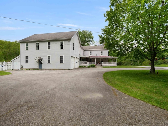 1851 York Street Ext, Poultney, VT 05764 - view of front of home with a porch, a garage, and driveway