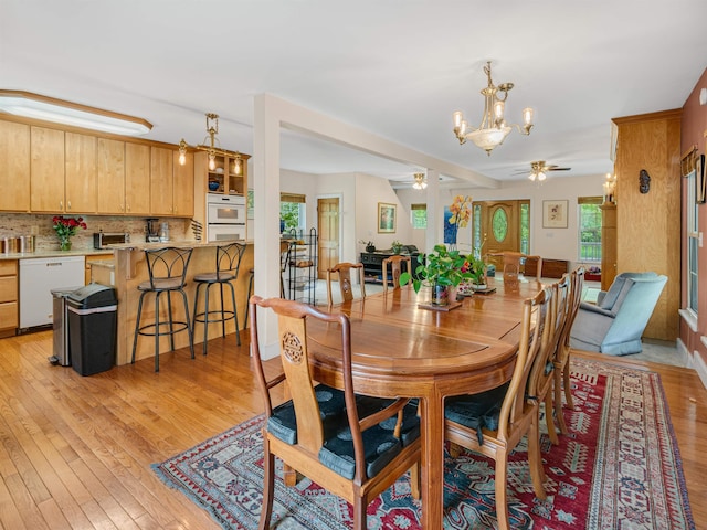1851 York Street Ext, Poultney, VT 05764 - dining area featuring a ceiling fan, a chandelier, and light wood-style flooring