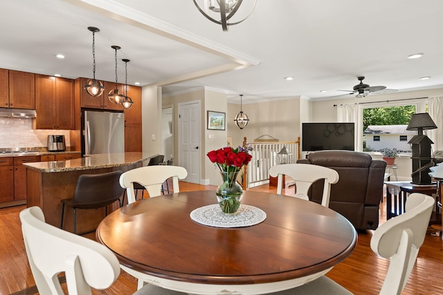165 Tanglewood Dr, Colchester, VT 05546 - dining room with light wood-style floors, a ceiling fan, recessed lighting, and crown molding