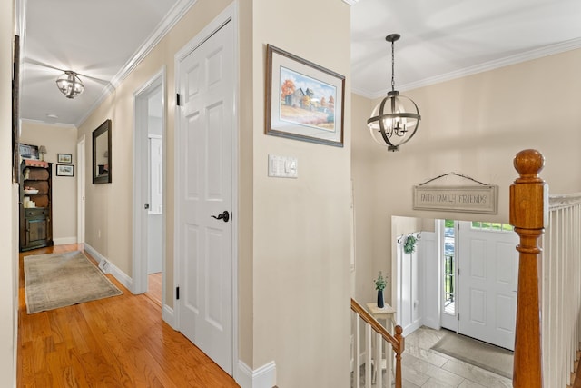 165 Tanglewood Dr, Colchester, VT 05546 - foyer with a chandelier, crown molding, and baseboards