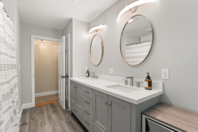 165 Tanglewood Dr, Colchester, VT 05546 - bathroom with double vanity and wood finished floors