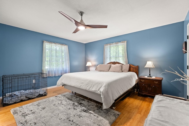 165 Tanglewood Dr, Colchester, VT 05546 - bedroom featuring multiple windows, wood finished floors, and a ceiling fan
