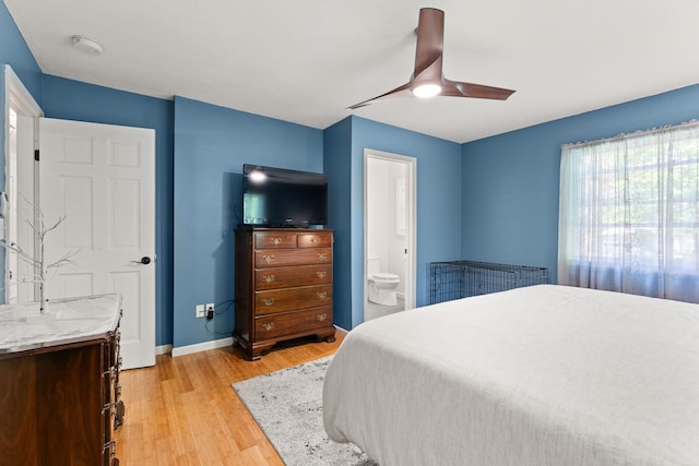 165 Tanglewood Dr, Colchester, VT 05546 - bedroom with light wood-type flooring, baseboards, ensuite bathroom, and ceiling fan