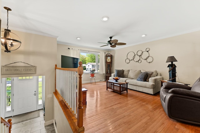 165 Tanglewood Dr, Colchester, VT 05546 - living area with a chandelier, crown molding, a ceiling fan, baseboards, and recessed lighting
