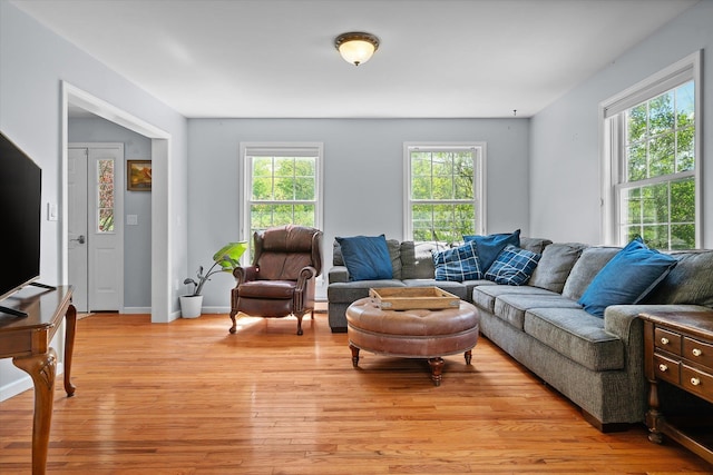 2351 Sugar Hill Rd, Wallingford, VT 05742 - living area with plenty of natural light, light wood finished floors, and a baseboard radiator