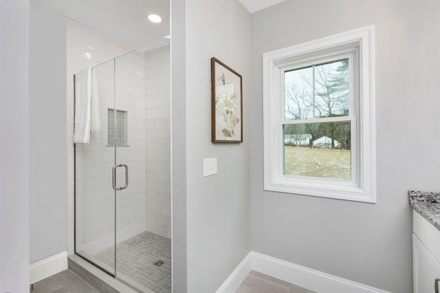 148 County Rd, Amherst, NH 03055 - full bathroom featuring a shower stall, baseboards, and vanity