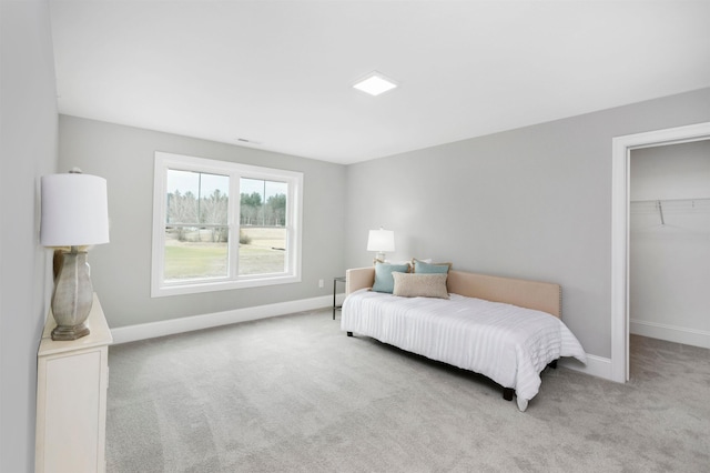 148 County Rd, Amherst, NH 03055 - carpeted bedroom featuring baseboards, a walk in closet, and a closet