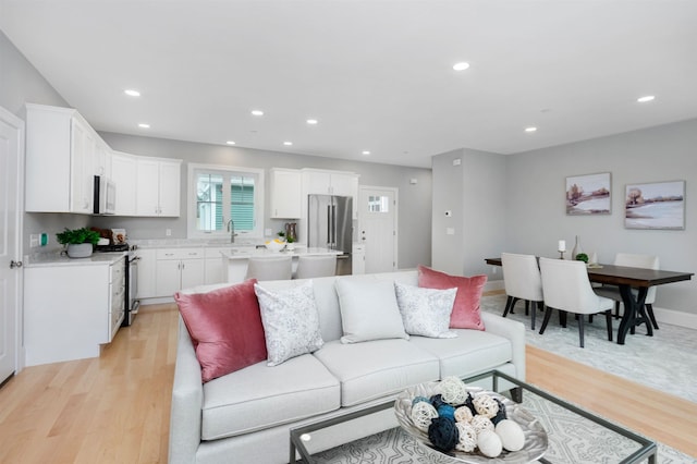 148 County Rd, Amherst, NH 03055 - living room with light wood-type flooring, recessed lighting, and baseboards
