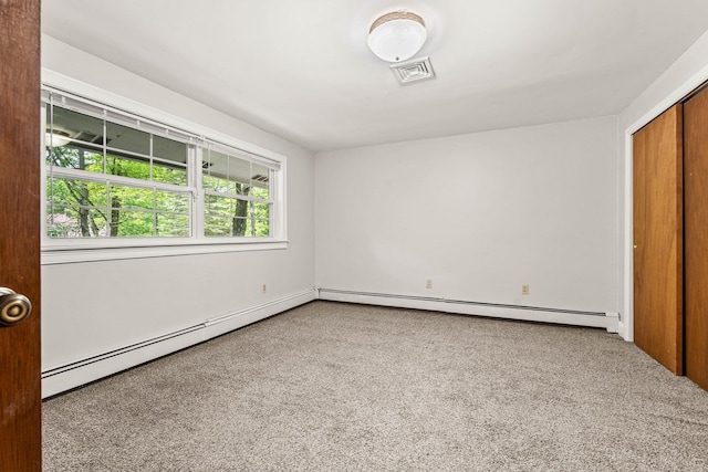 28 Olde Lantern Rd, Bedford, NH 03110 - unfurnished bedroom featuring carpet flooring, a baseboard heating unit, and a closet