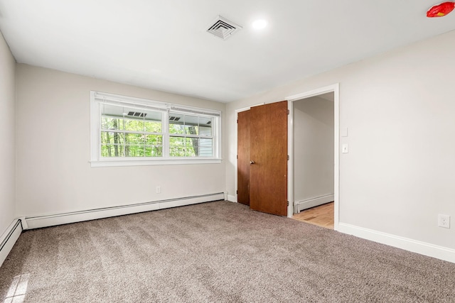 28 Olde Lantern Rd, Bedford, NH 03110 - unfurnished bedroom with a baseboard radiator, light carpet, and baseboards
