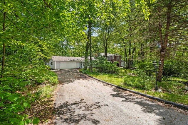28 Olde Lantern Rd, Bedford, NH 03110 - view of front of home with asphalt driveway and a garage