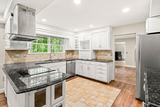 28 Olde Lantern Rd, Bedford, NH 03110 - kitchen with wall chimney exhaust hood, stainless steel appliances, a sink, open shelves, and white cabinetry