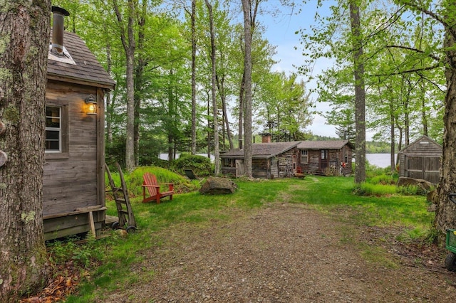 138 Miller Dr, Nelson, NH 03457 - view of grassy yard with an outdoor structure and a water view