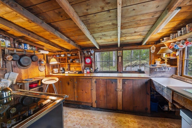 138 Miller Dr, Nelson, NH 03457 - kitchen with wood ceiling with exposed beams, plenty of natural light, and range