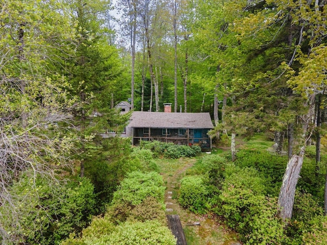 138 Miller Dr, Nelson, NH 03457 - view of front facade with a chimney and a wooded view