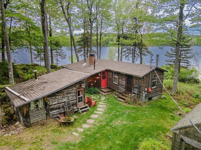 138 Miller Dr, Nelson, NH 03457 - view of front of house featuring a water view, a chimney, a front yard, and a shingled roof