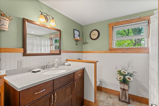 122 Wallace Rd, Northfield, VT 05663 - bathroom with vanity, toilet, and a wainscoted wall