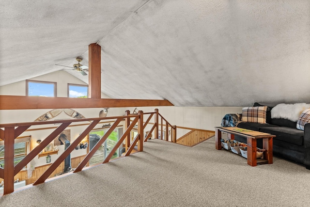 122 Wallace Rd, Northfield, VT 05663 - bonus room with a textured ceiling, carpet floors, vaulted ceiling, ceiling fan, and wood walls